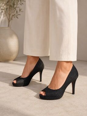 Stuart Weitzman Black  Heels with perp toe worn once  8 1/2 retail $550 US